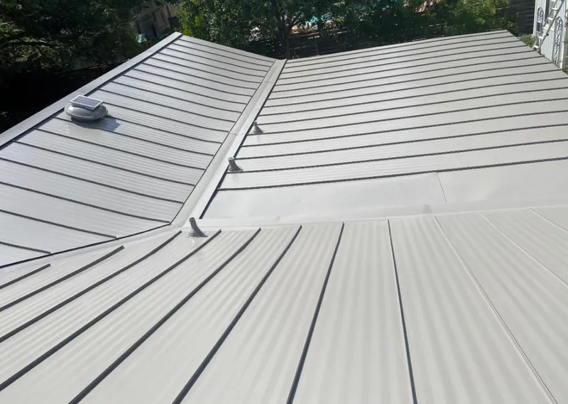 Solar attic fan installed on a metal roof for Roof Ventilation in Bayou Cane